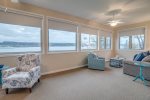 Sunroom seating areas with windows overlooking Keuka Lake